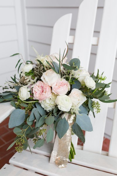 European hand tied bridal bouquet with seeded eucalyptus, silver dollar eucalyptus, blush garden roses, hydragea, astilbe, and ranunculus