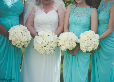 White and Tiffany Blue Wedding | White hydrangea, roses, spray roses and ranunculus bridesmaids bouquets