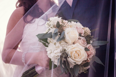 Blush, champagne and white hand tied bridal bouquet